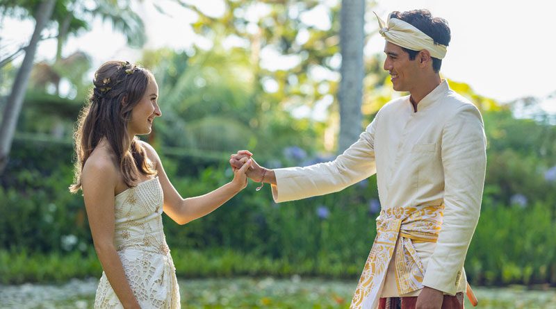 Kaitlyn Dever and Maxime Bouttier in "Ticket to Paradise" (2022)